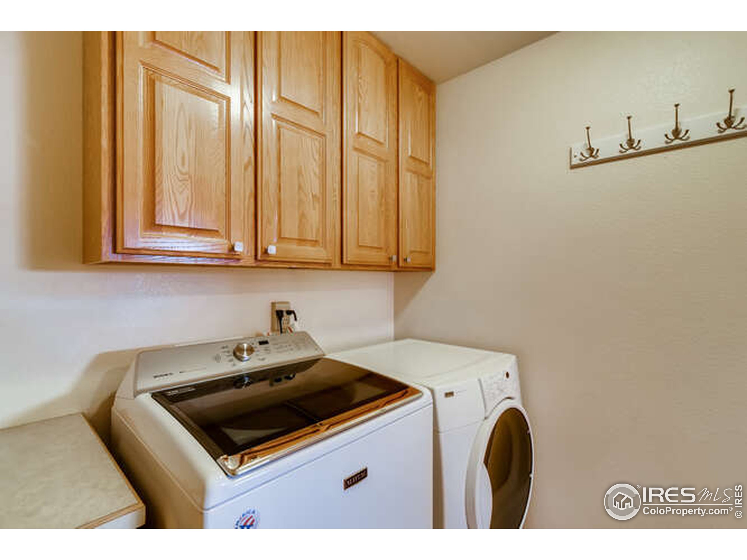 206 Victoria Street Berthoud, CO 80513 - Photo 16 of 29 a kitchen with stainless steel appliances granite countertop a sink stove and cabinets