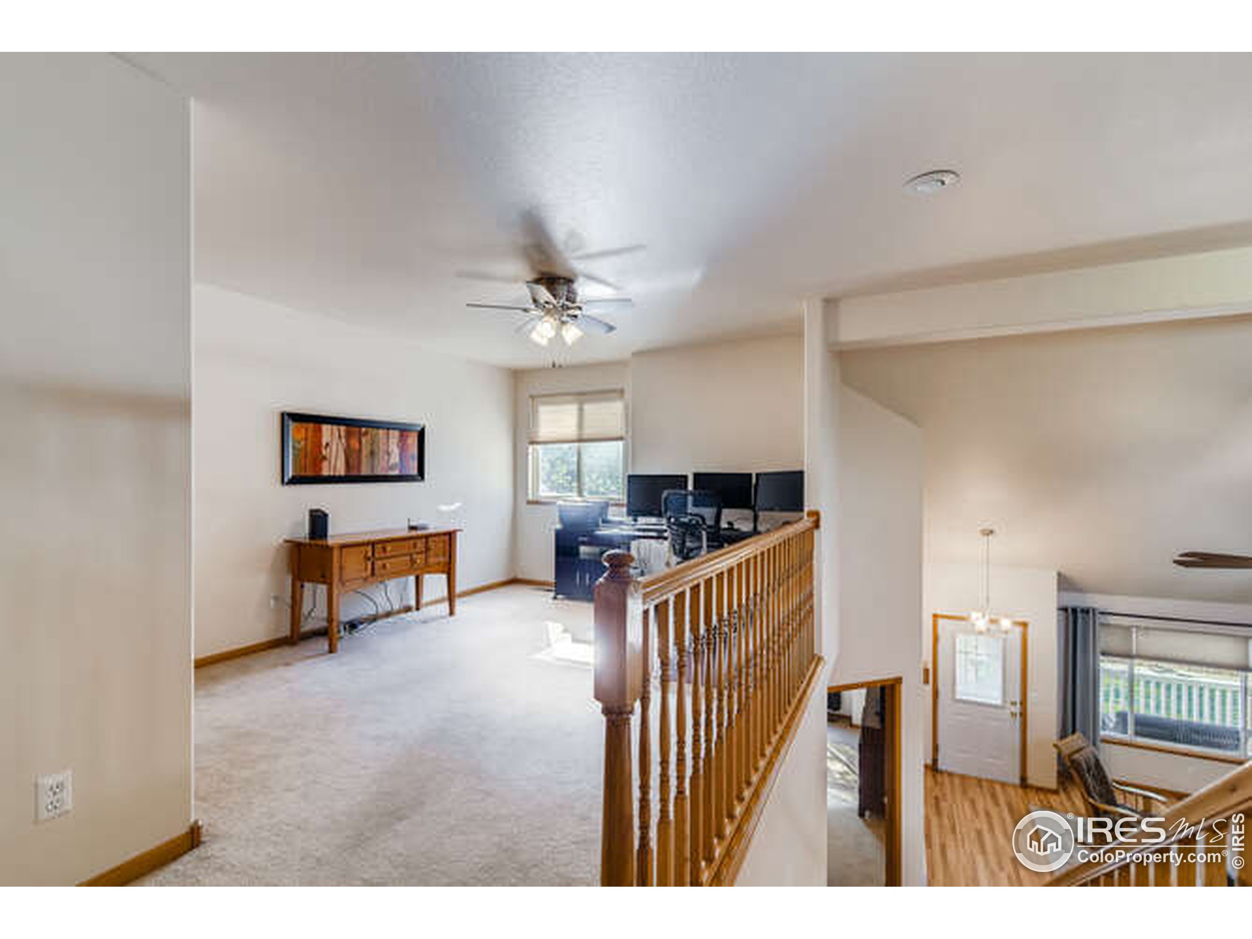 206 Victoria Street Berthoud, CO 80513 - Photo 19 of 29 a view of a livingroom with furniture and a kitchen