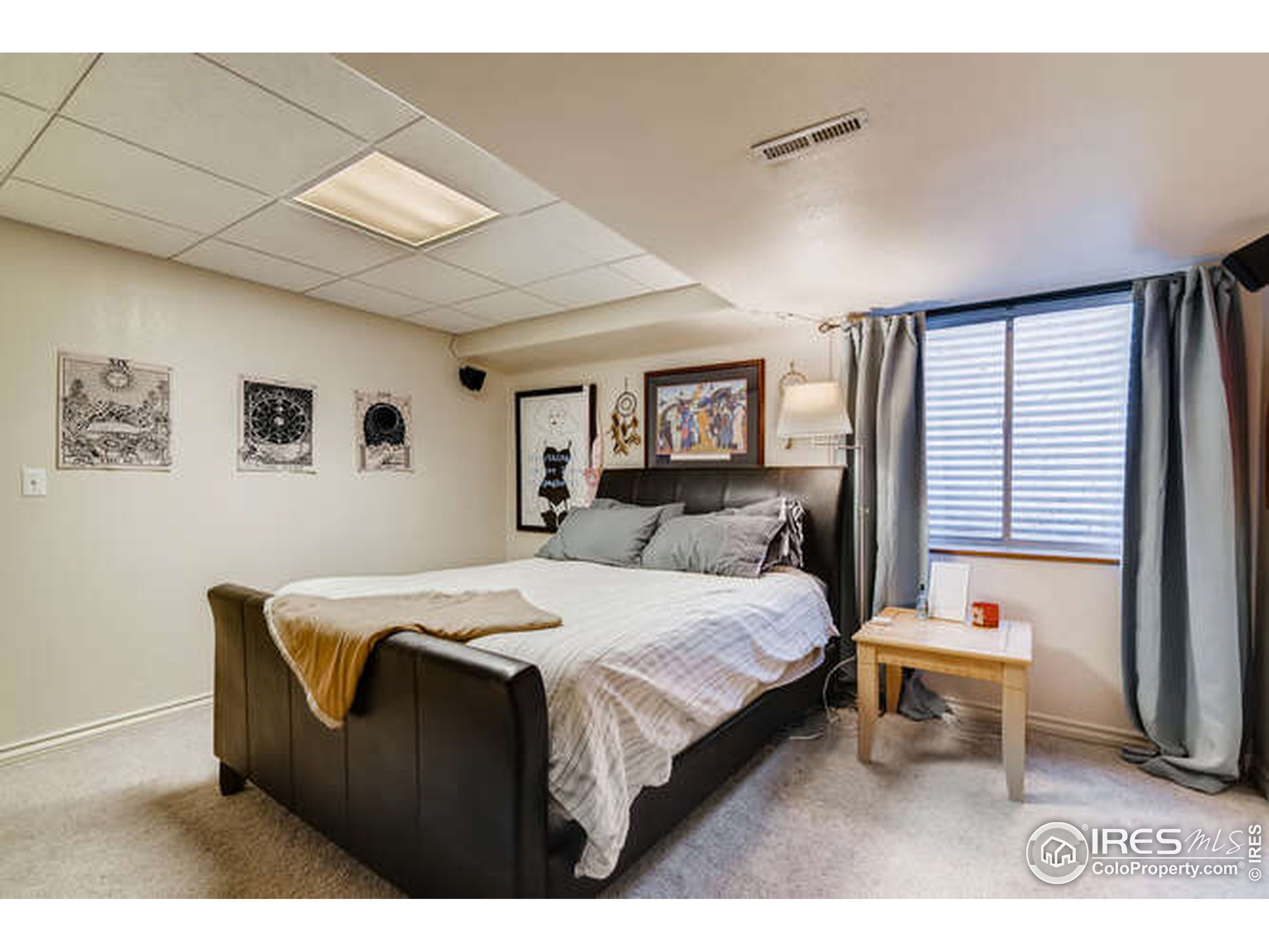 206 Victoria Street Berthoud, CO 80513 - Photo 23 of 29 a bedroom with a bed and a window