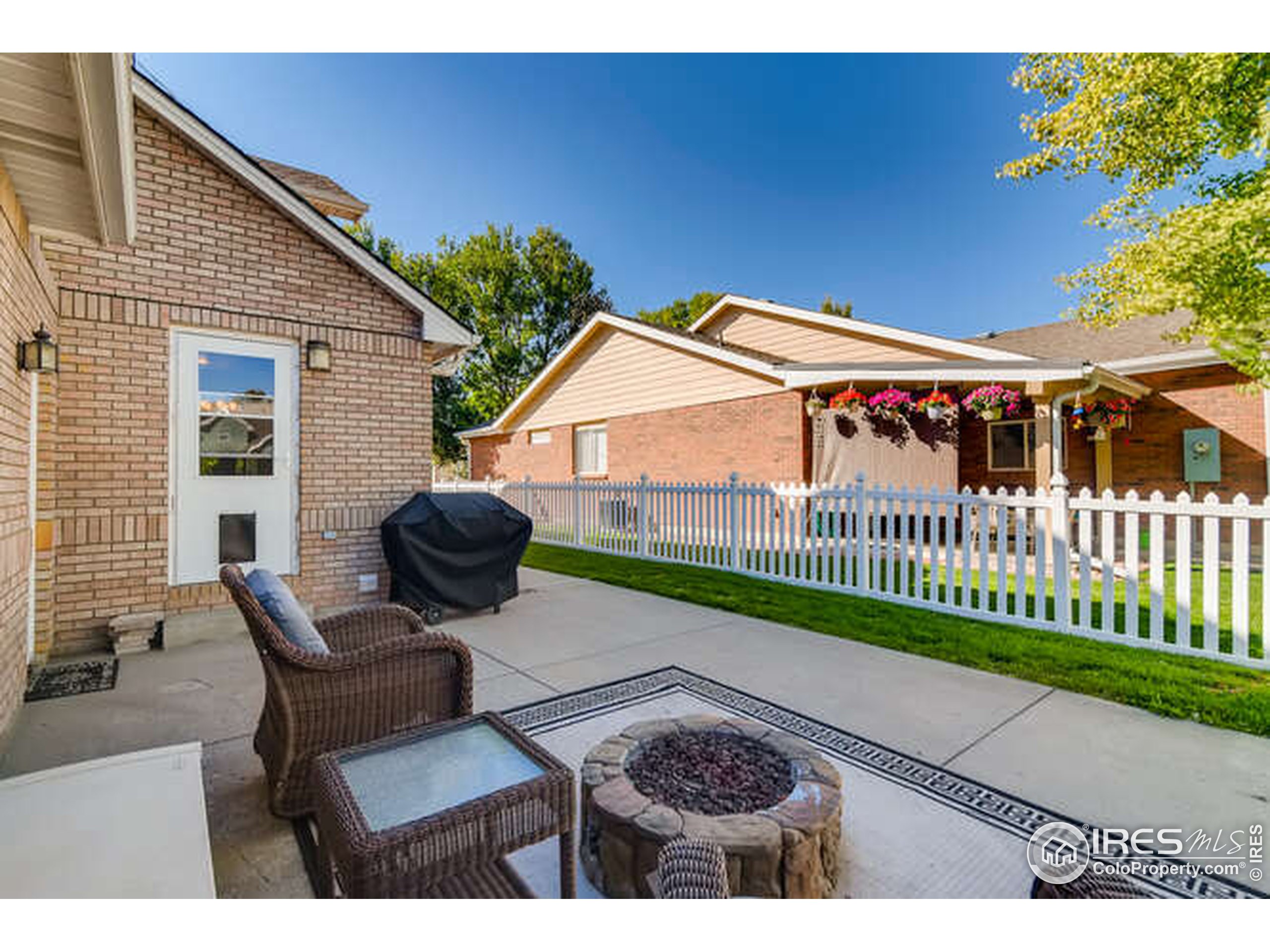 206 Victoria Street Berthoud, CO 80513 - Photo 26 of 29 a view of a chairs and table in the patio