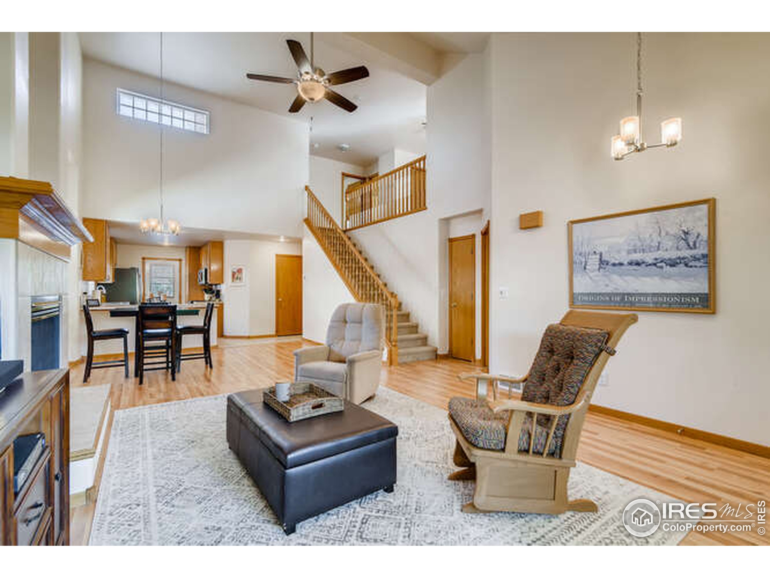 206 Victoria Street Berthoud, CO 80513 - Photo 5 of 29 a living room with furniture and wooden floor