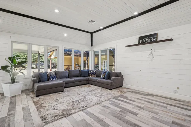 a living room with furniture and a rug