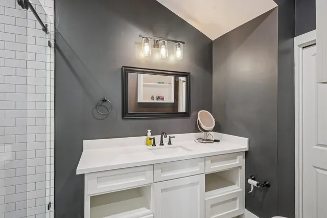 a bathroom with a sink and a mirror