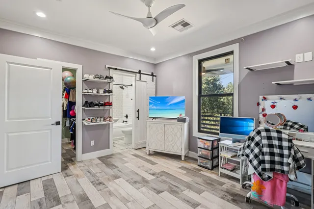 a kitchen with stainless steel appliances kitchen island granite countertop a refrigerator and a sink