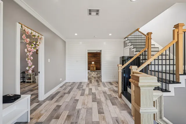 a view of entryway with wooden floor