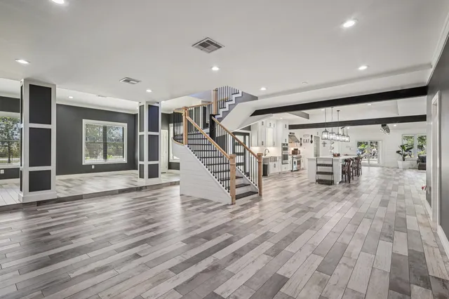a view of an entryway with wooden floor