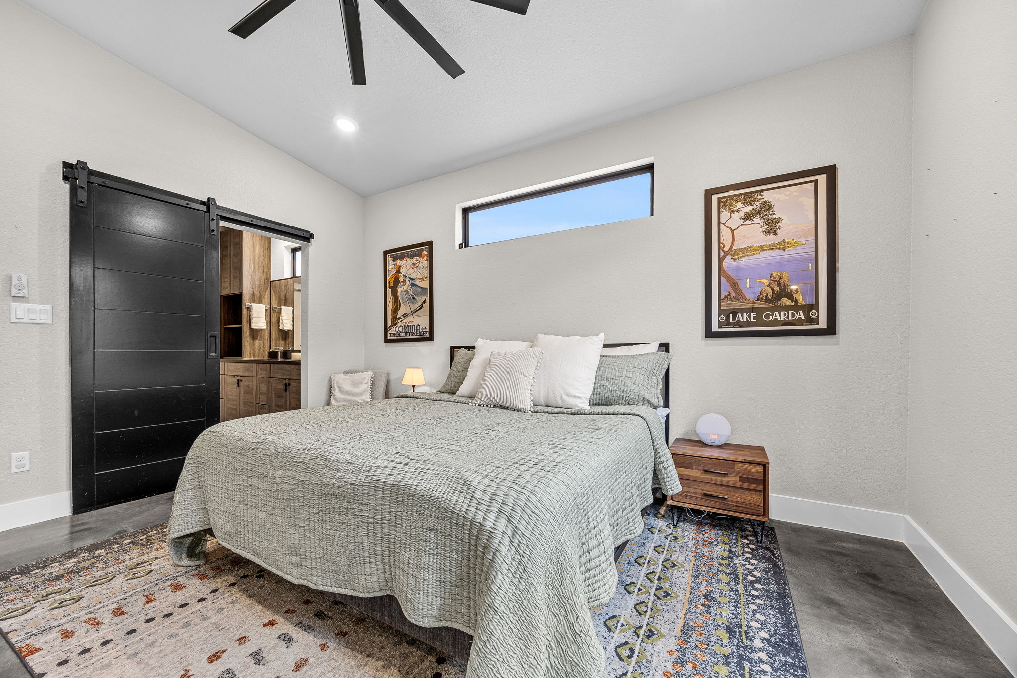 408 Martin Luther King Jr Street Georgetown, TX 78626 - Photo 13 of 35 a spacious bedroom with a bed and a lamp on dresser