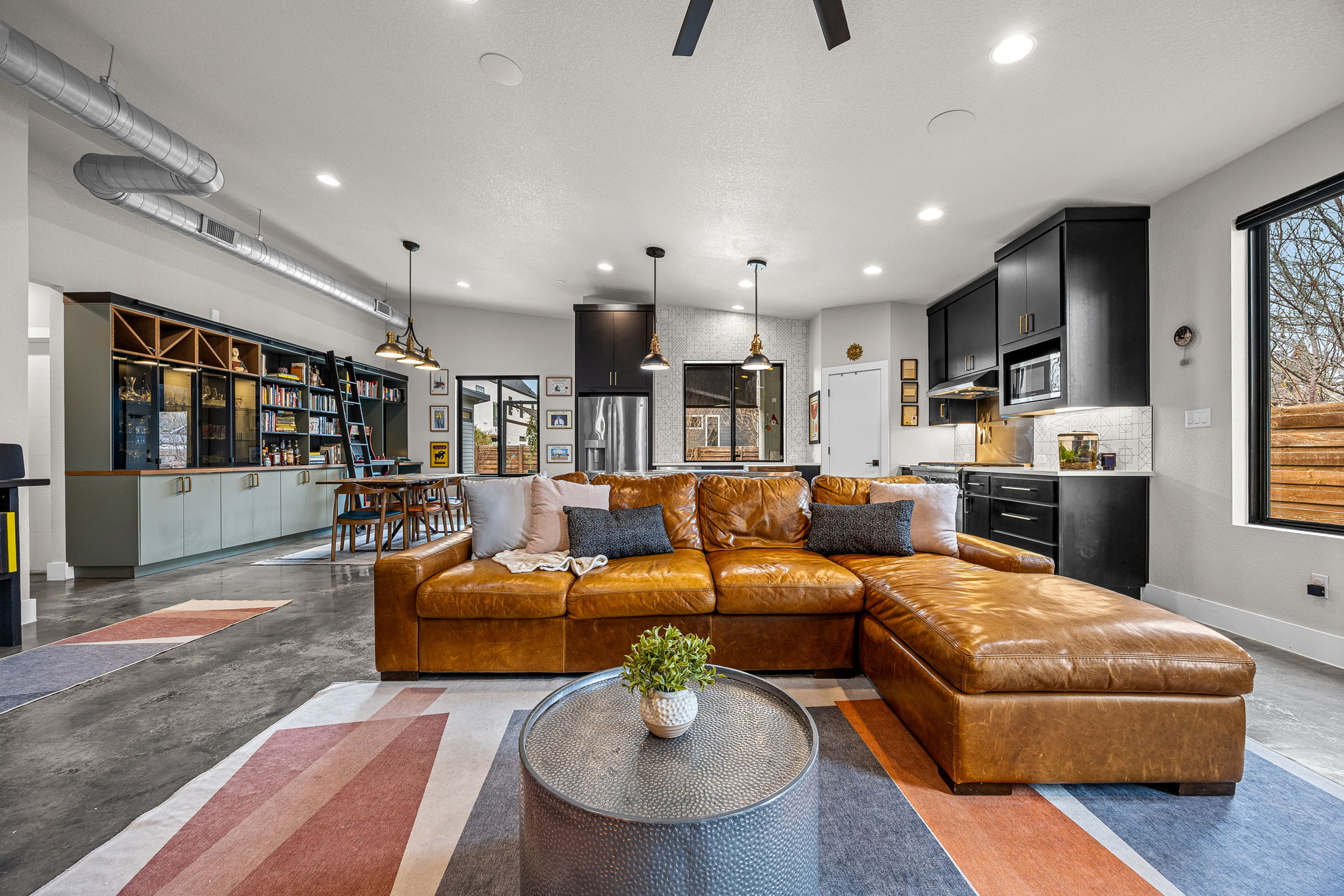 408 Martin Luther King Jr Street Georgetown, TX 78626 - Photo 3 of 35 a living room with furniture kitchen view and a wooden floor