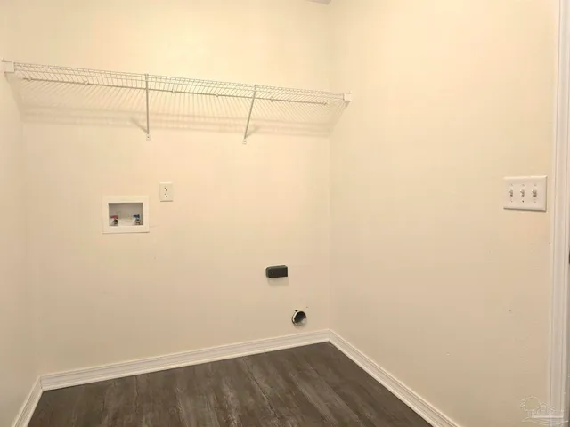 a view of a small space with wooden floor