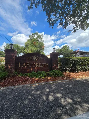 a view of a barn in the middle of a yard