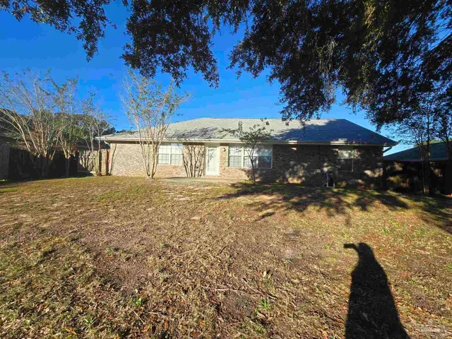a backyard of a house with lots of green space