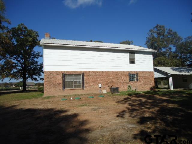 16994-c R 223 C R 223 Arp, TX 75750 - Photo 5 of 38 a view of backyard with plants and large trees