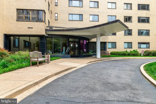 a bed room with furniture and a large window
