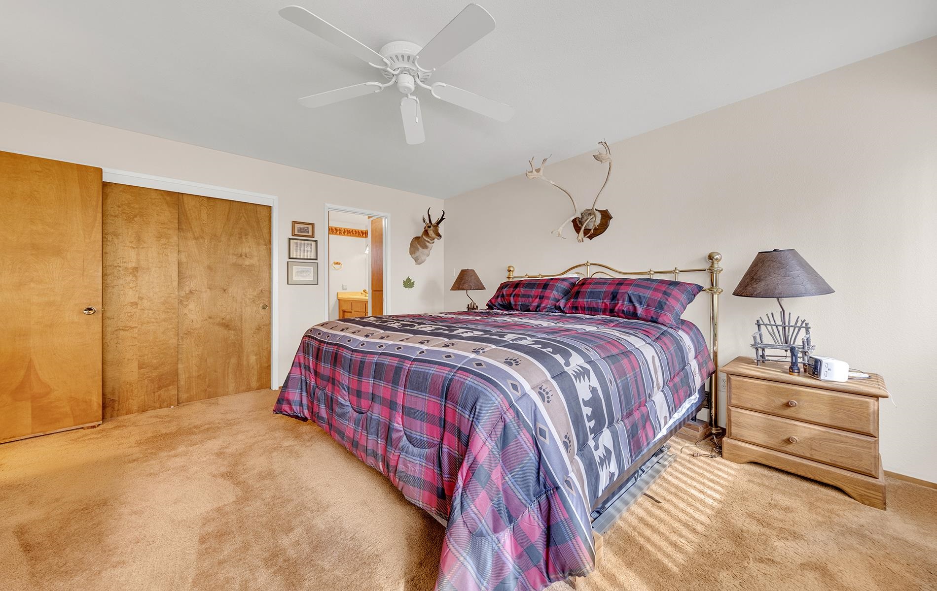 608 East Burnt Cedar Road Lake Almanor, CA 96137 - Photo 22 of 36 a bedroom with a bed and a lamp