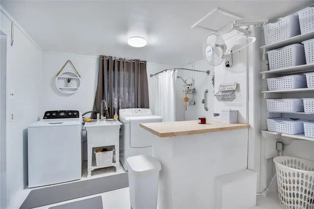 a living room with patio furniture and a floor to ceiling window