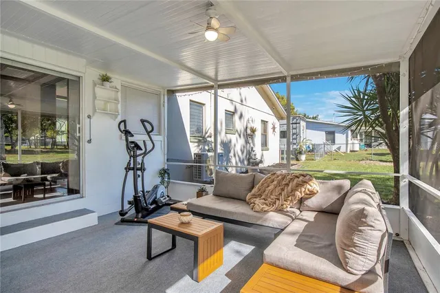 a view of a swimming pool with an outdoor space and seating area
