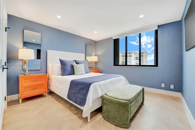 a bedroom with a bed and lamp