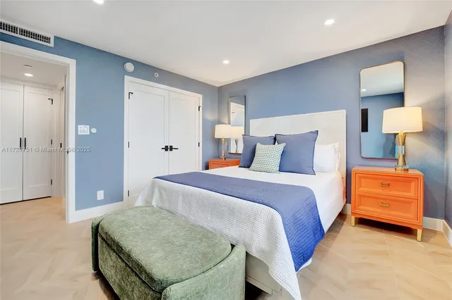 a bedroom with a bed and a couch