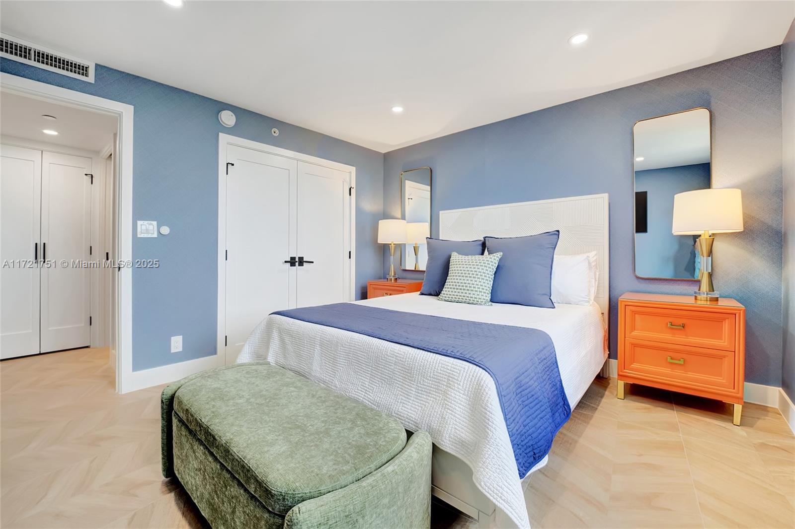 300 Ocean Trail Way, Unit 702 Jupiter, FL 33477 - Photo 22 of 30 a bedroom with a bed and a couch