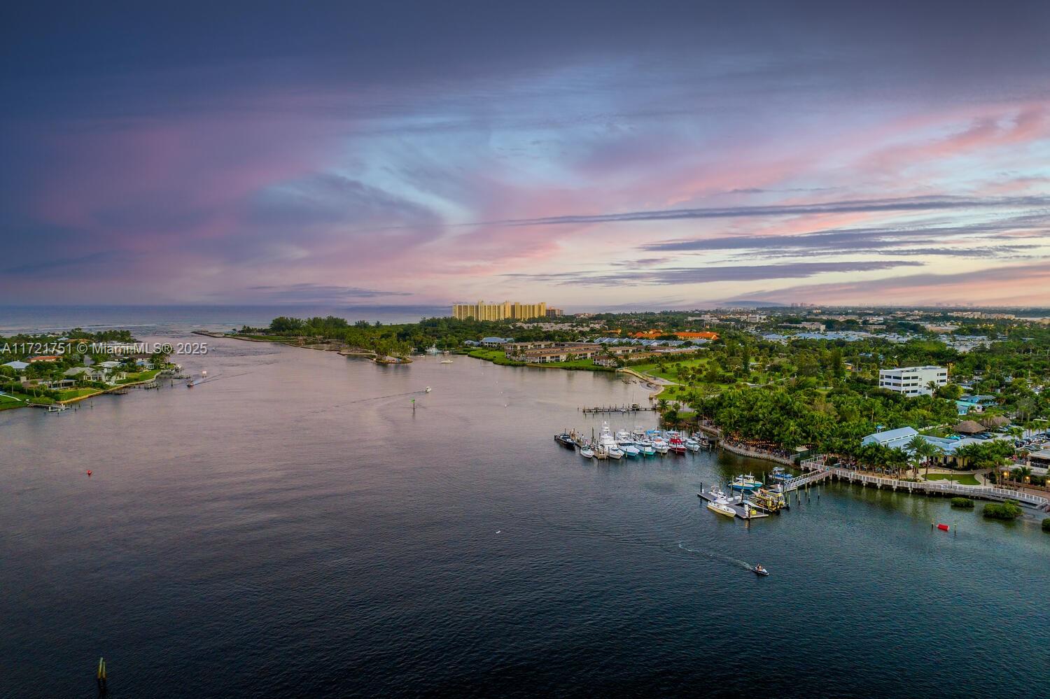 300 Ocean Trail Way, Unit 702 Jupiter, FL 33477 - Photo 28 of 30 a view of a lake with houses