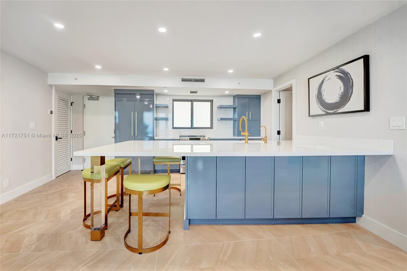 300 Ocean Trail Way, Unit 702 Jupiter, FL 33477 - Photo 5 of 30 a kitchen with a table and chairs in it