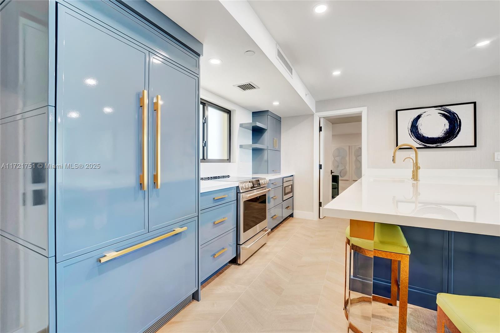 300 Ocean Trail Way, Unit 702 Jupiter, FL 33477 - Photo 6 of 30 a kitchen with stainless steel appliances granite countertop a stove a sink and a refrigerator