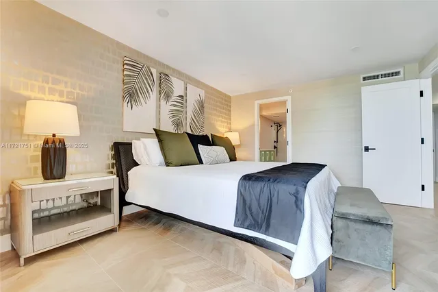 a bedroom with a bed and window