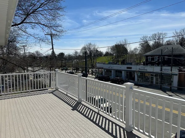 a balcony with wooden floor