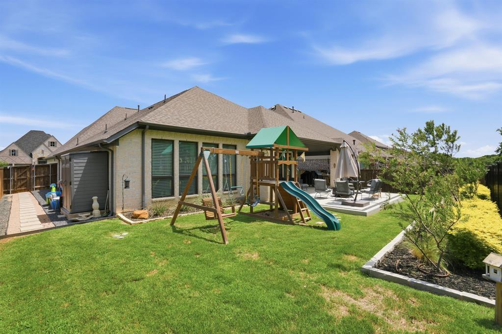 904 Fallbrook Avenue Denton, TX 76210 - Photo 29 of 30 a view of a house with backyard porch and sitting area