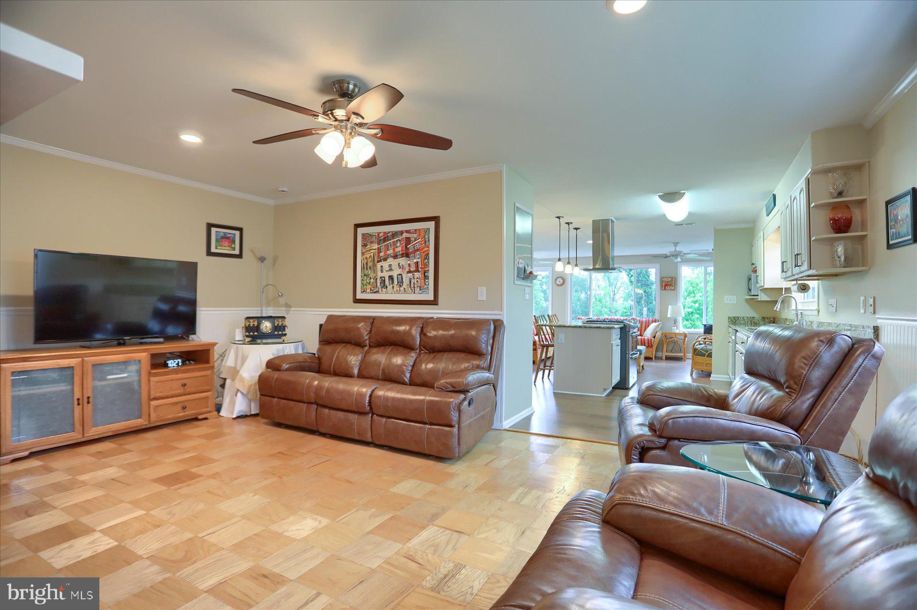 24 Neptune Drive Joppa, MD 21085 - Photo 18 of 70 a living room with furniture and a flat screen tv