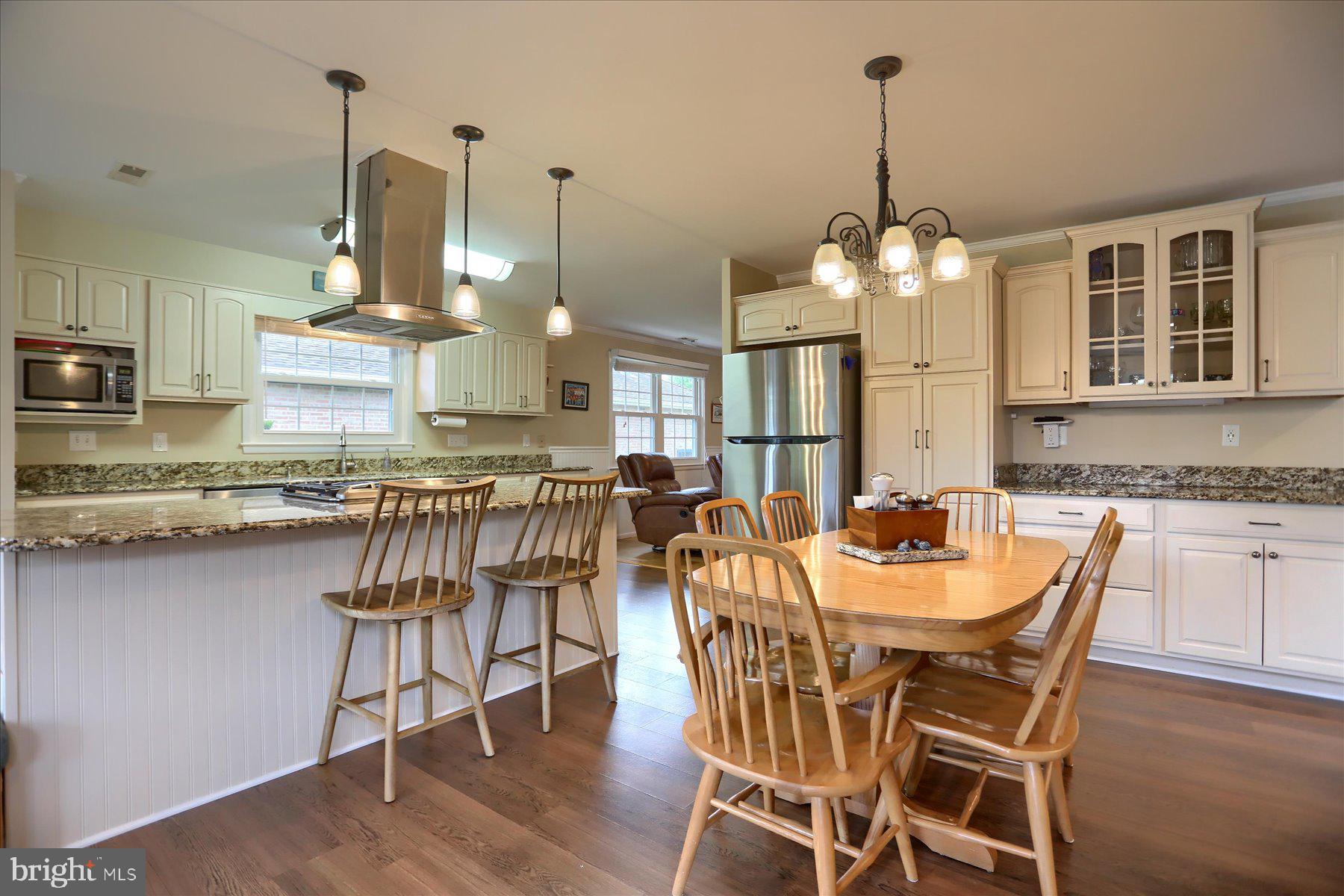 24 Neptune Drive Joppa, MD 21085 - Photo 20 of 70 a dining room filled with furniture and wooden floor