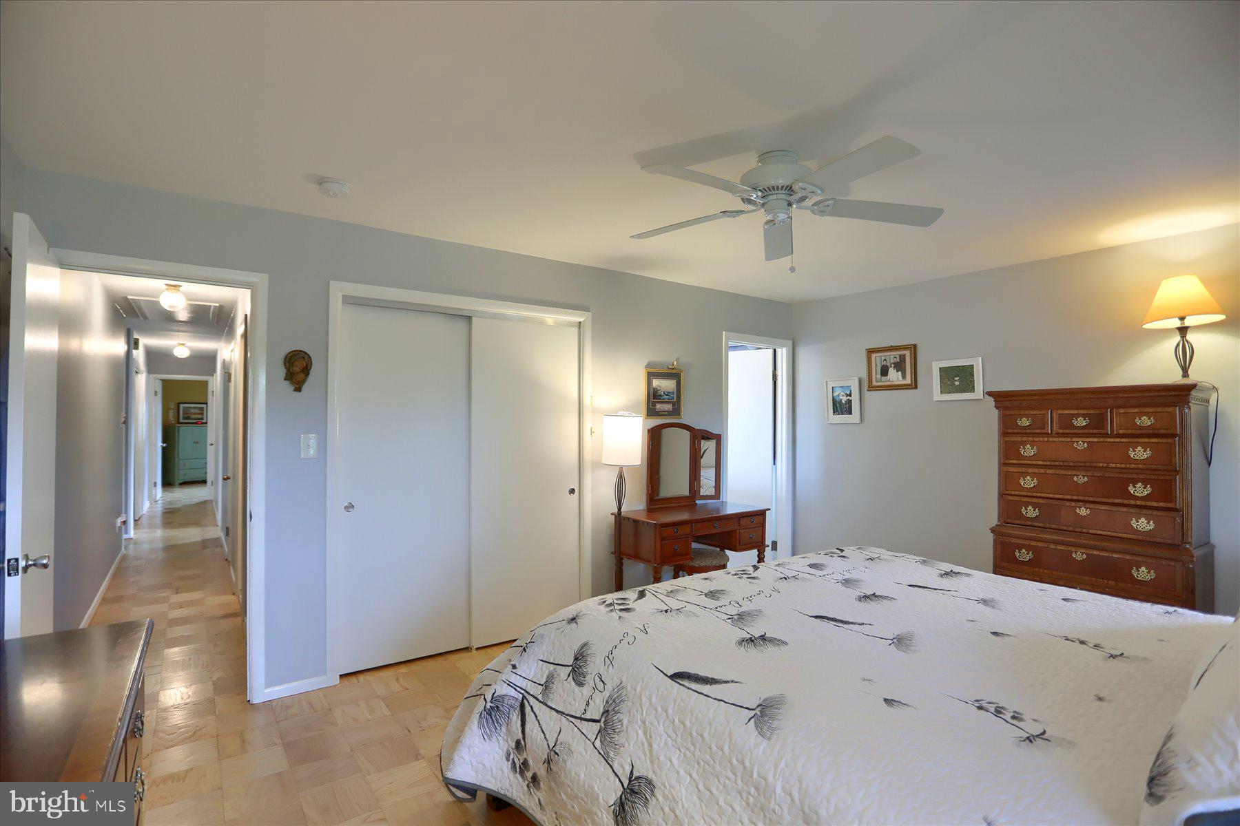 24 Neptune Drive Joppa, MD 21085 - Photo 29 of 70 a bedroom with a dresser and a chandelier