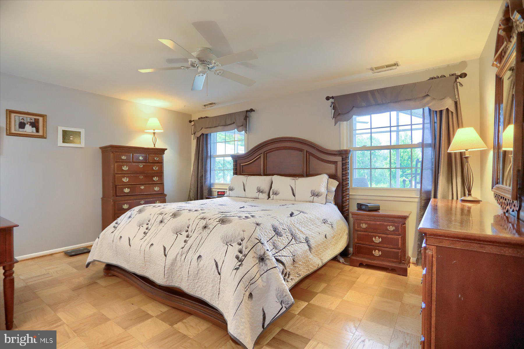24 Neptune Drive Joppa, MD 21085 - Photo 30 of 70 a bedroom with a bed and wooden floor
