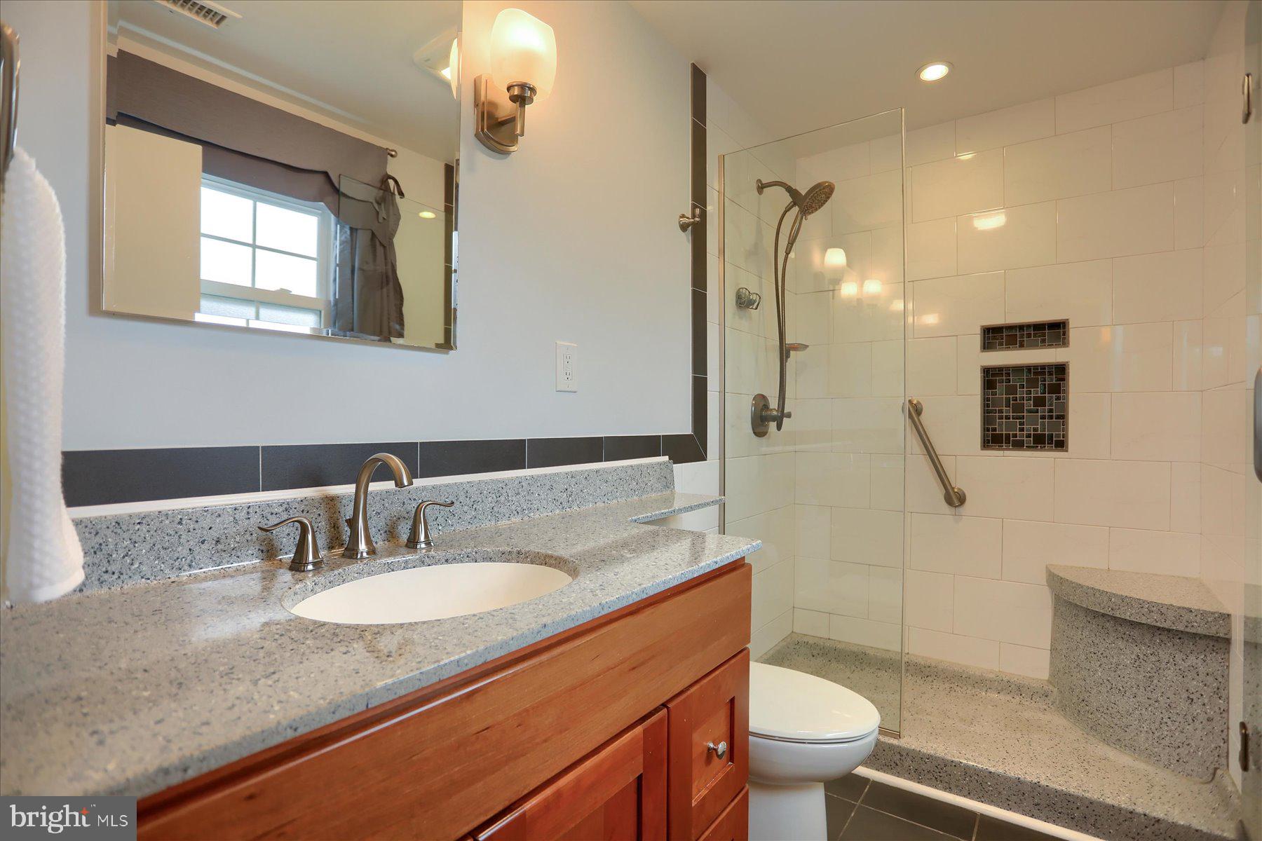 24 Neptune Drive Joppa, MD 21085 - Photo 31 of 70 a bathroom with a granite countertop sink toilet and shower
