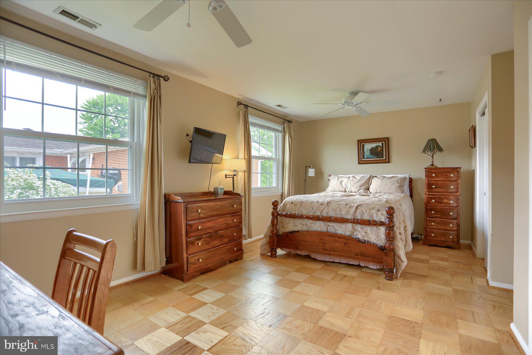 24 Neptune Drive Joppa, MD 21085 - Photo 33 of 70 a bedroom with a bed and a dresser next to a window