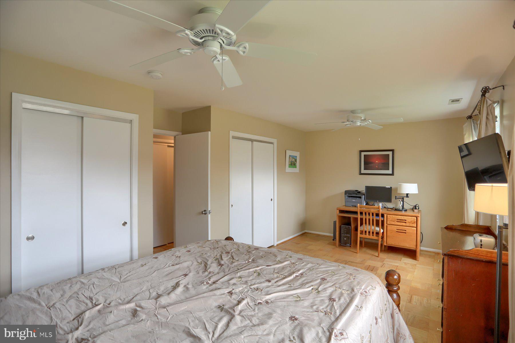 24 Neptune Drive Joppa, MD 21085 - Photo 34 of 70 a bedroom with a bed and a chandelier