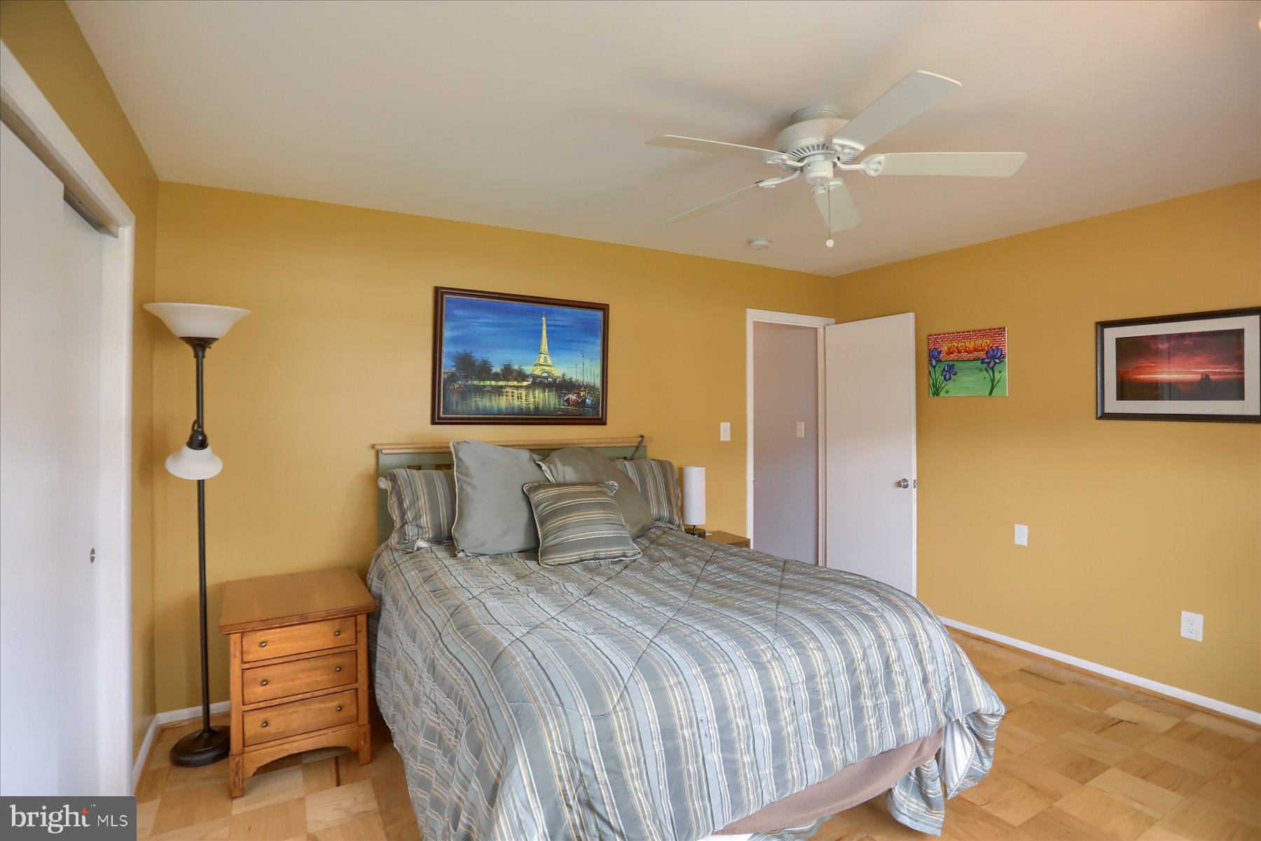 24 Neptune Drive Joppa, MD 21085 - Photo 38 of 70 a bedroom with a bed and a chandelier