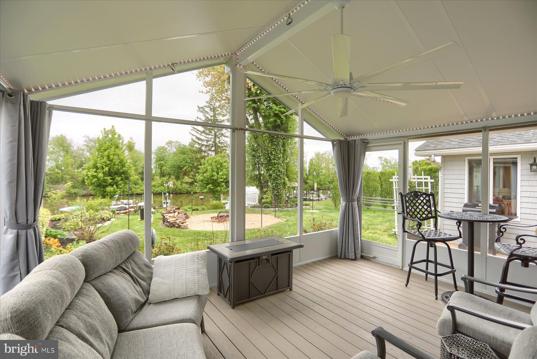 24 Neptune Drive Joppa, MD 21085 - Photo 41 of 70 a living room with furniture and floor to ceiling windows