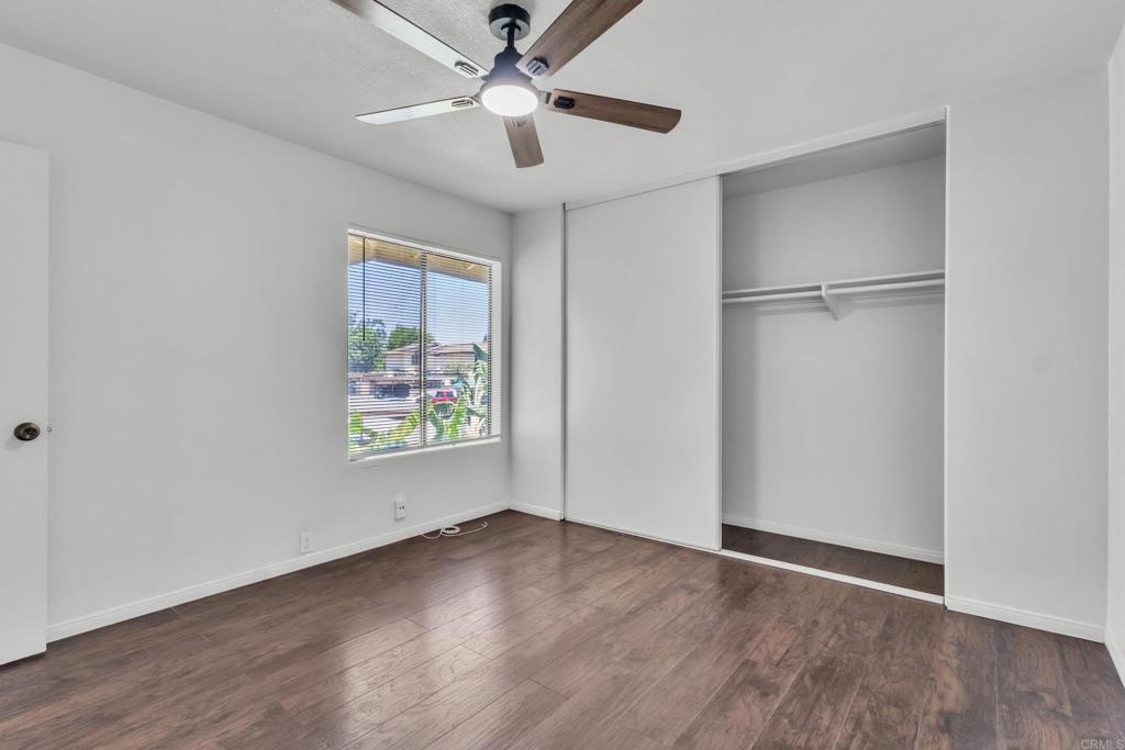 237 Rancho Drive, Unit C Chula Vista, CA 91911 - Photo 15 of 23 wooden floor in an empty room with a window