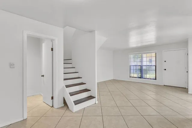 a view of a livingroom with stairs