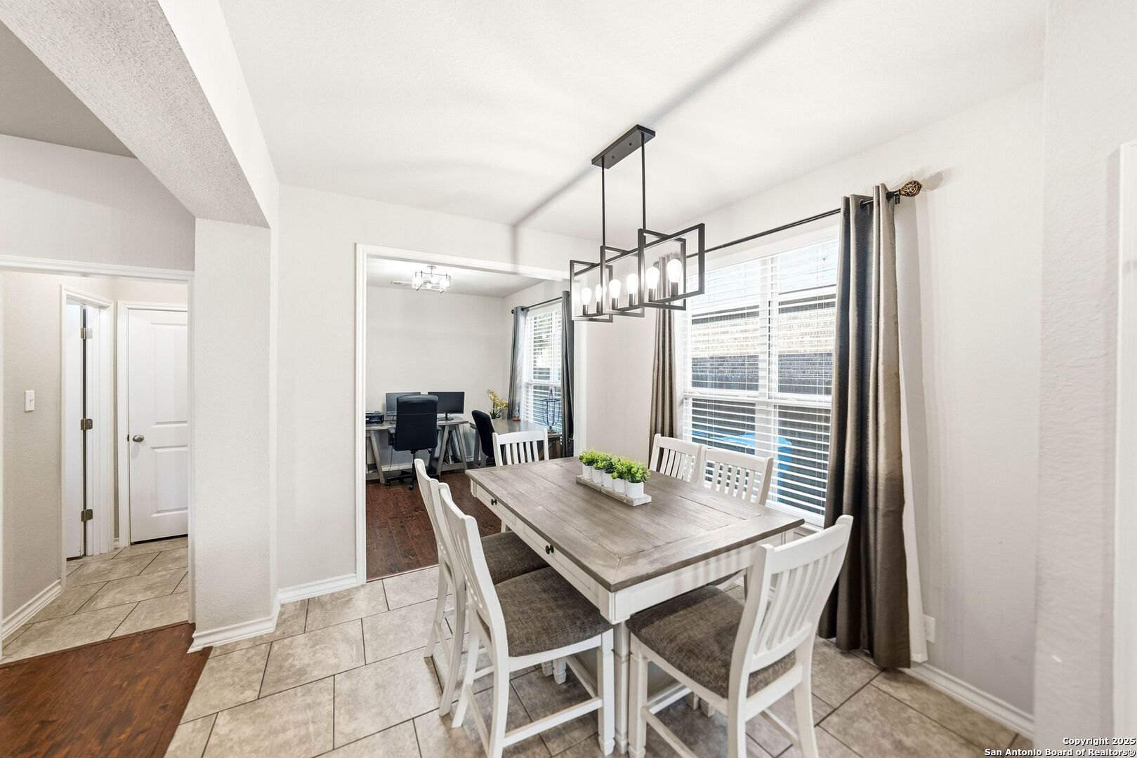 30622 Horseshoe Path Bulverde, TX 78163 - Photo 11 of 44 a view of a dining room with furniture window and wooden floor