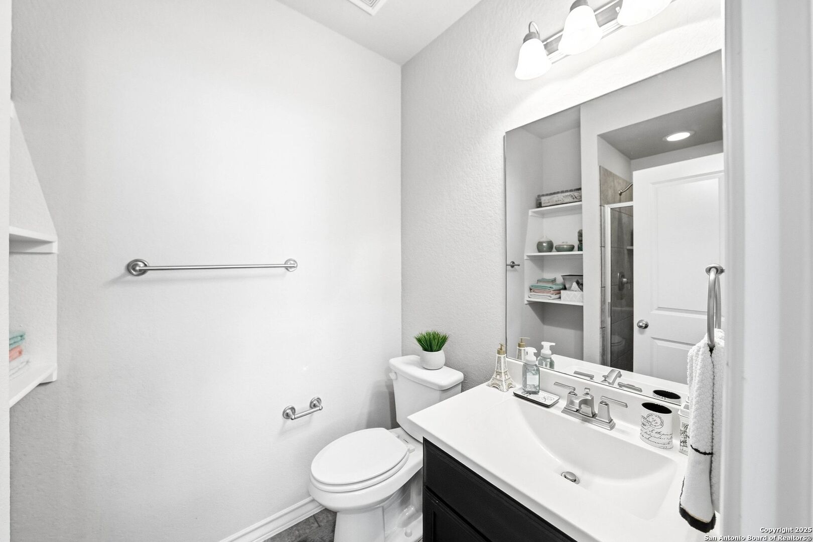 30622 Horseshoe Path Bulverde, TX 78163 - Photo 14 of 44 a bathroom with a sink toilet and shower