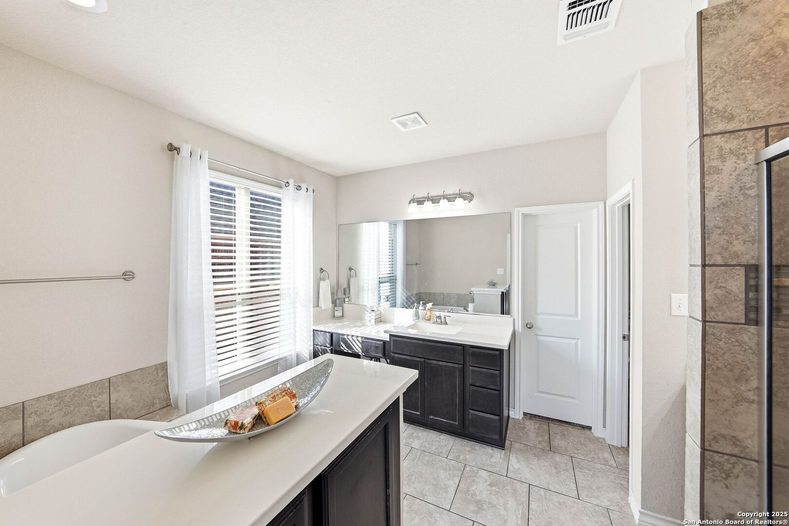30622 Horseshoe Path Bulverde, TX 78163 - Photo 19 of 44 a kitchen with a sink and a refrigerator