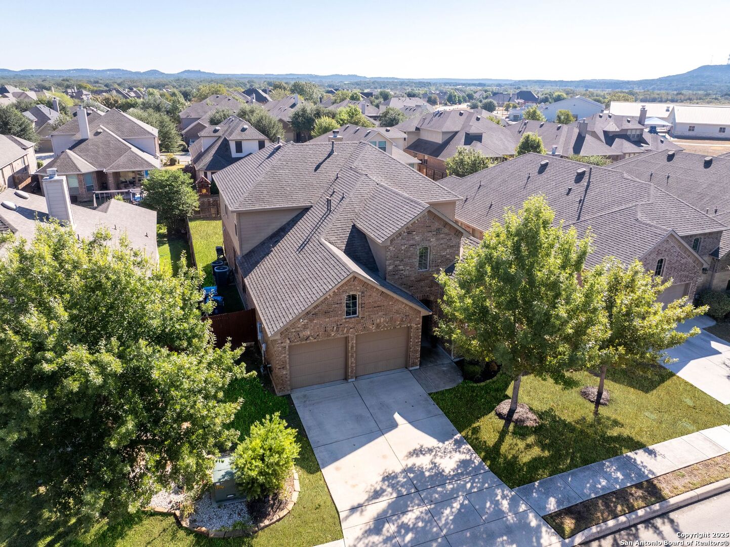 30622 Horseshoe Path Bulverde, TX 78163 - Photo 2 of 44 an aerial view of a house with a yard and garden