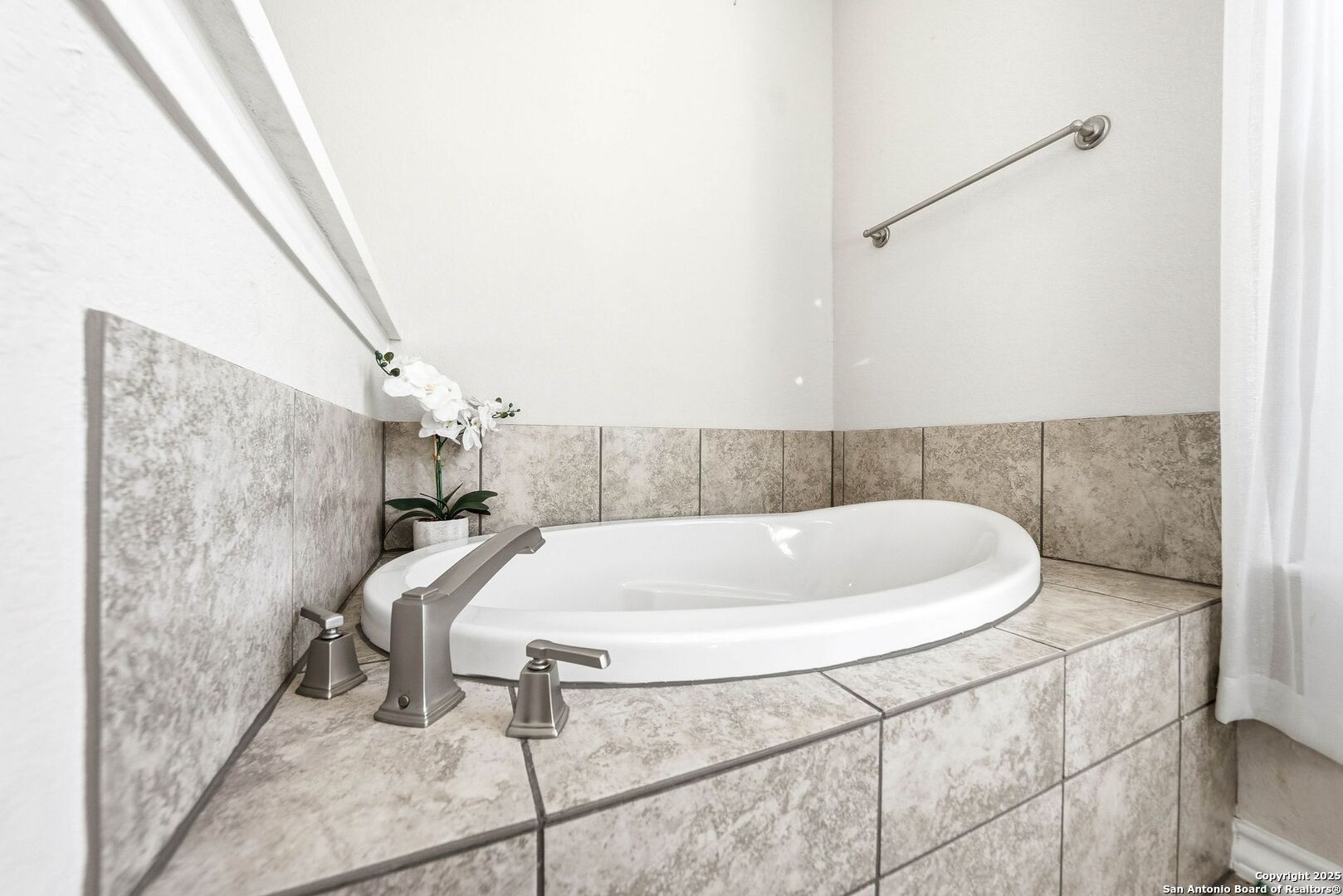 30622 Horseshoe Path Bulverde, TX 78163 - Photo 21 of 44 a bathroom with a bathtub and shower