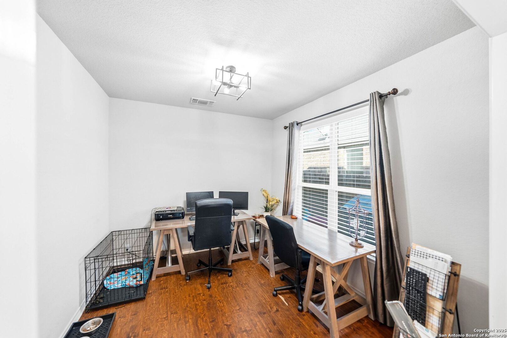 30622 Horseshoe Path Bulverde, TX 78163 - Photo 22 of 44 a view of a workspace with furniture and a window