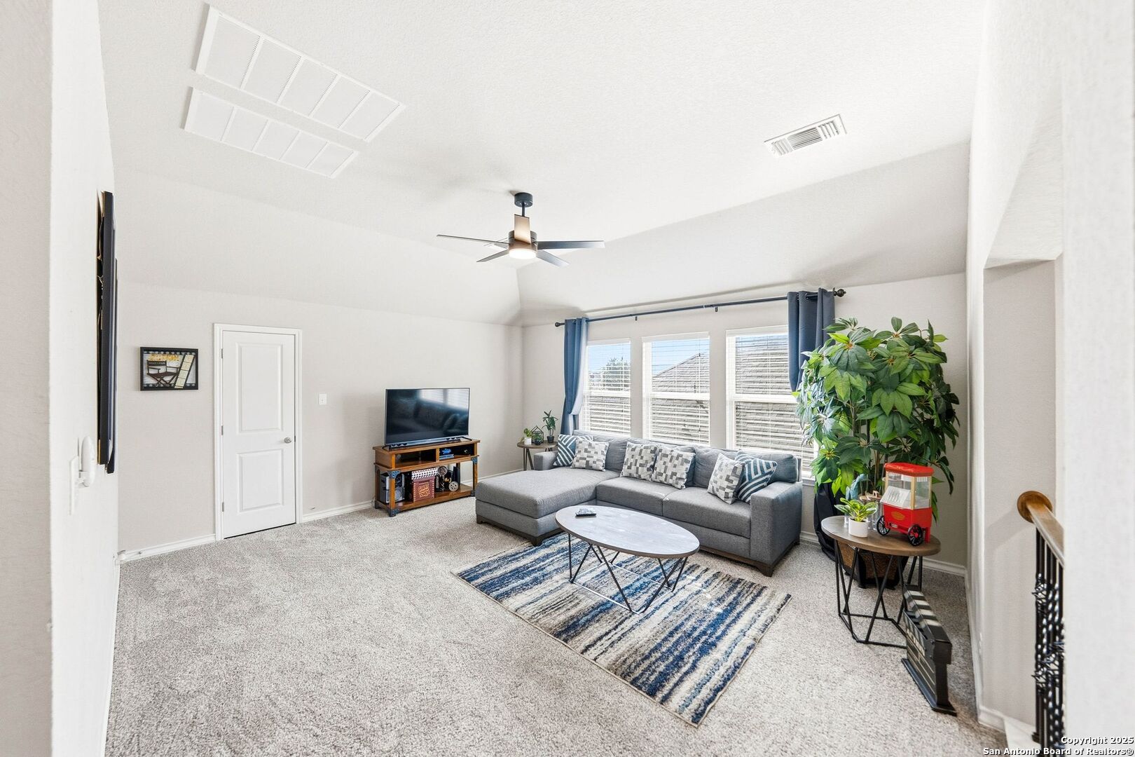 30622 Horseshoe Path Bulverde, TX 78163 - Photo 23 of 44 a living room with furniture and a flat screen tv