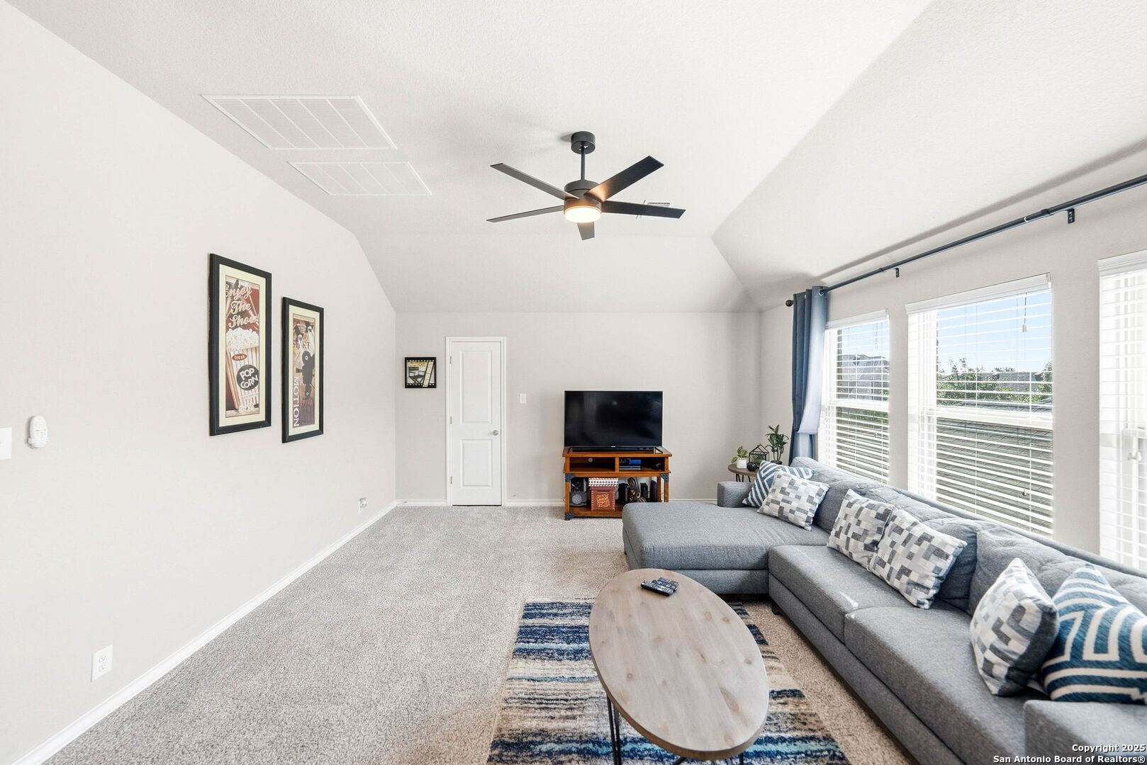 30622 Horseshoe Path Bulverde, TX 78163 - Photo 24 of 44 a living room with furniture or couch and a flat screen tv