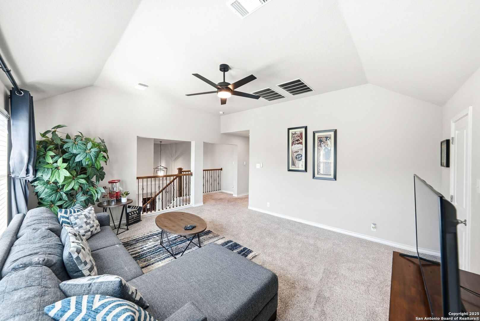 30622 Horseshoe Path Bulverde, TX 78163 - Photo 25 of 44 a living room with furniture and a ceiling fan