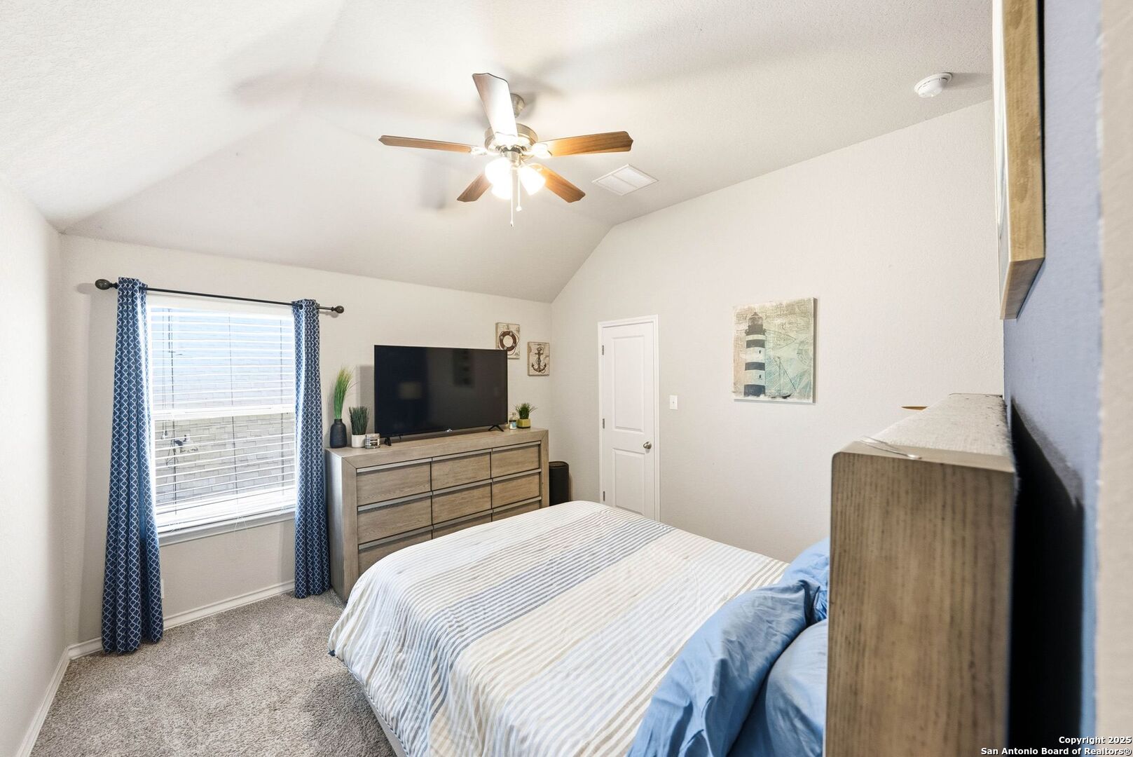 30622 Horseshoe Path Bulverde, TX 78163 - Photo 26 of 44 a bedroom with a bed and a flat screen tv